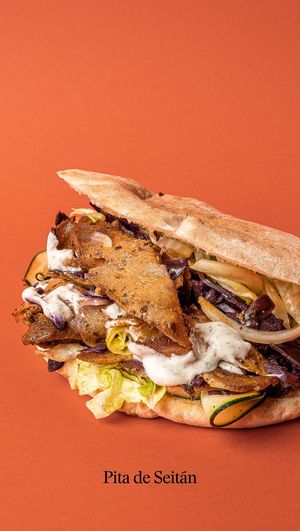 Marinated seitan in a pita bread with pickled cabbage, lettuce, cucumber, onion and piparra. With soy yogurt sauce and hot sauce. at Good Shit, Vegan Kebabs in Barcelona