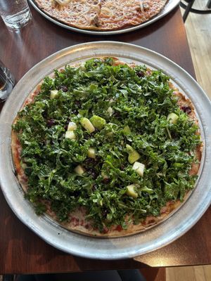 Winter kale salad pizza with vegan cheese at Colony Grill in Milford