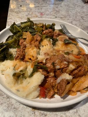 Chicken stirfry, collard greens, mashed potatoes. at Uptown Veg in New York City