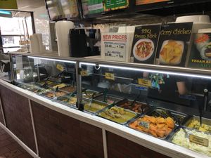 Row of food; you point to what you want, the server then puts it in a plastic bowl and the cashier weighs it. at Uptown Veg in New York City