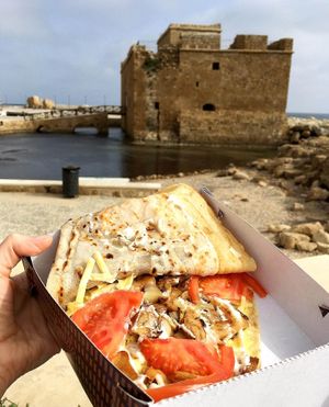 Inner world of plant based "chicken" crepe: vegan cheese, plant based "chicken", caramelised onion, mushrooms, tomato, vegan mayo at Frendo in Paphos