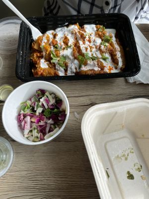 Burani, served with bread and a side salad at Spice Bridge - Food Hall in Tukwila