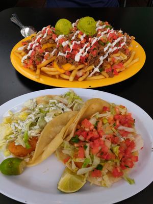 Carnitas fries and fish tacos! at Pancho's Vegan Tacos in Long Beach