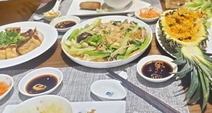 Left: Lemongrass fried tofu, Middle: flat noodles and vegetables in mushroom sauce, Right: pineapple fried rice at San May in Phu Quoc