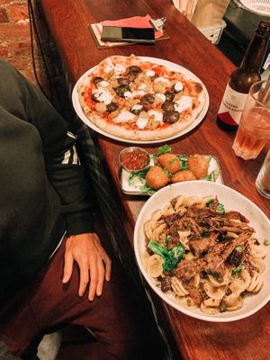 Cheese crochettes, pollo pizza and the orecchiette pasta with added pulled brisket (A recommended dish from the staff). at Nolita in Wellington