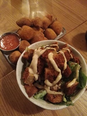 Ceasar salad with added seitan chicken: definitely add chicken, it was the best part of the dish but overall a great salad although a little overpriced + gnocco fritto: basically f at Nolita in Wellington