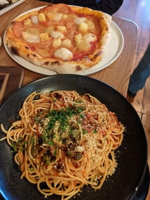 Puttanesca spaghetti and ham and pineapple pizza at Nolita in Wellington