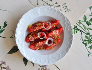 Tomatoes with candied lemon, spring onion and chives at Zrodlo in Warsaw