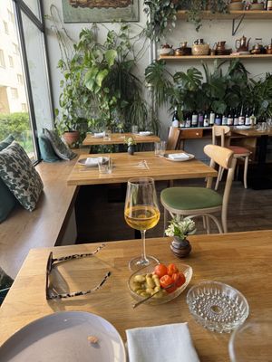 Dogwood “olives” with roast cherry tomatoes and local rough cider  at Zrodlo in Warsaw