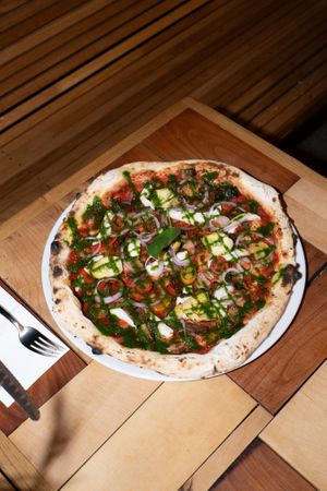 Naples Style pizza with sauce on top at Disco Pizza in Luzern