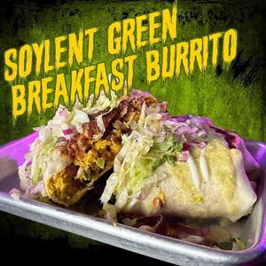 Soylent Green Breakfast Burrito. Tofu scramble, green chili sauce, pinto beans, cheese, hash browns, fajita veggies, sour cream, and cilantro. Comes smothered!  at Terror Tacos in St Louis