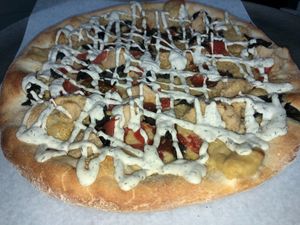 Ricotta cheese, pepperoni, black olives, tomatoes and a finishing touch of ranch dressing! Everything is vegan certified.  at Mamma Mia's Pizza in Garfield