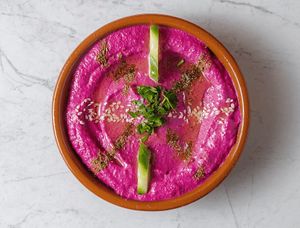 Beetroot hummus: beetroot puree, boiled chickpeas puree, tahini, fresh lemon juice, herbs, spices, extra virgin olive oil at Beirut Lebanese Kitchen in Strovolos