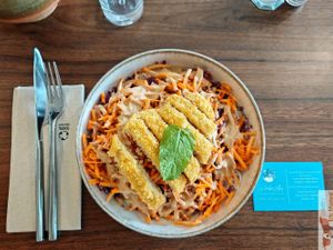 Thai salad with rice noodles, breaded vegetable strips, raw vegetables, and peanut sauce. at Les Herbes Folles in Dourdan