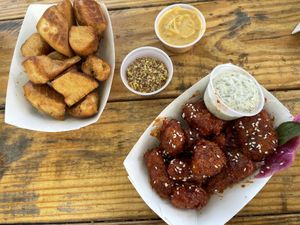 Korean bbq “chicken” and pretzel bites with credo queso and yummy grainy mustard!  at Sunny's Backyard in Austin