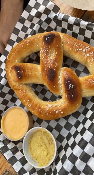 Pretzel with queso & grainy mustard  at Sunny's Backyard in Austin