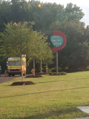 This is where all of our food trucks congregate and ironically this is her right there beside the sign at Eliza's Vegan Café in Florence