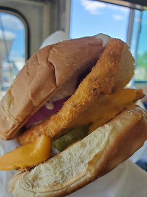 Our fish sandwich has two fish cutlets, pickles, red onions, and tartar sauce. All vegan. at Eliza's Vegan Café in Florence