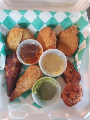 Sample Platter: 2 Veggie Dumplings, 2 "Chicken" Nuggets, 2 Chickpea Fritters, 1 BBQ Drumstick, 1 Fried Drumstick. at Eliza's Vegan Café in Florence