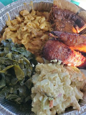 Christmas Dinner: Mac & "Cheese", Collard Greens, Potato Salad, BBQ "Chicken" Drumsticks, Sweet Potato Pie. Hmmmmmm at Eliza's Vegan Café in Florence
