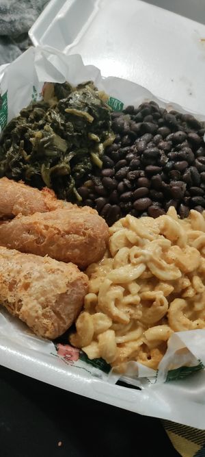 Meat & 3 - drumsticks, mac n cheese, mustard greens, black beans and yellow rice at Eliza's Vegan Café in Florence