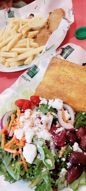 Side Greek salad and Jamaican beef patty at Eliza's Vegan Café in Florence