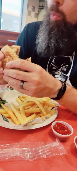 Classic chicken sandwich and fries at Eliza's Vegan Café in Florence