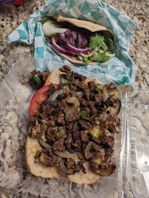 Cheese steak and a raw veggie pita at Eliza's Vegan Café in Florence