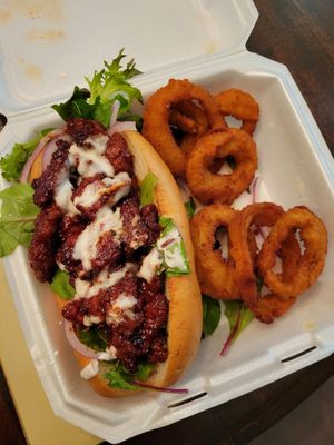 Rib sandwich and onion rings at Eliza's Vegan Café in Florence