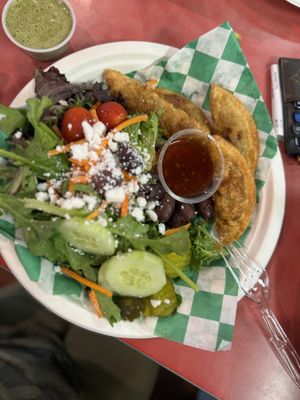 Greek salad with dumplings   at Eliza's Vegan Café in Florence