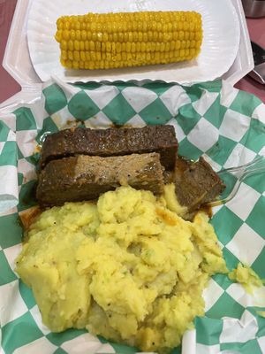 Meatloaf with mashed potatoes and corn and topped with gravy  at Eliza's Vegan Café in Florence