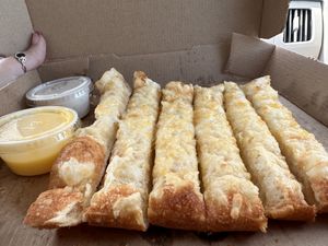 Plant based bread sticks w vegan garlic sauce.   at Toppers Pizza in Sheboygan