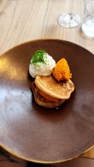 Buckwheat blinis with carrot tartar (fermented with Koji) and sour cream at Kasvio in Utrecht