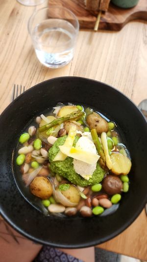 Green and white asparagus, Dutch beans, almond cream, asparagus bouillon, young potatoes, foraged pesto at Kasvio in Utrecht