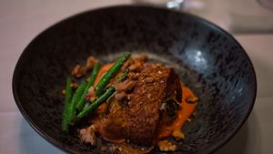 Zucchini involtini filled with pearled barley, buckwheat and herbs. Tempé, green beans and hazelnut sauce at Kasvio in Utrecht