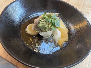 Main course: rye dough dumplings filled with seitan and nettle, served with turnip and hempseed in a kombu/mushroom jus. Tasty. at Kasvio in Utrecht