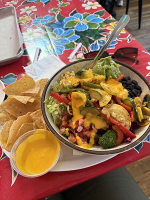 Veggie burrito bowl with vegan quesoo  at Lucharitos in Greenport