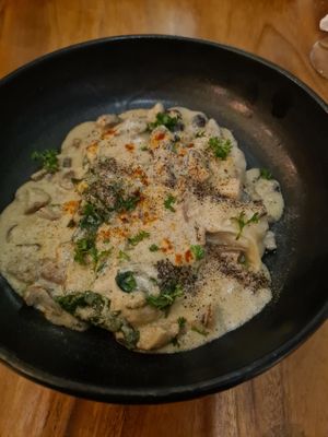 split dumplings in white wine mushroom sauce at Element Vegetarian in Phnom Penh