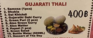 Gujarati Thali (desert is not vegan, server said everything else was but I don’t know if I believe him). at Khana Khazana in Bangkok