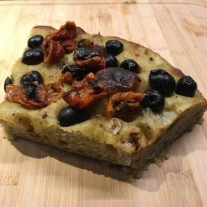 Dried tomatoes and black olives foccacia  at Land & Monkeys - Pernety in Paris