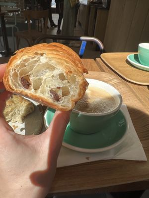 Chocolate croissant and oat late - super good😄 at Land & Monkeys - Pernety in Paris