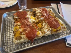 Half-size vegan SPO (sausage peppers onions) pizzaa  at Underground Pizza Company in Baltimore