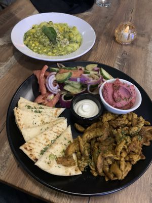 Pesto, gnocchi  & shawarma platter with hummus, and Israeli salad   at PiANTA in Providence