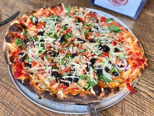 Veggie Pizza with vegan cheese that we brought at dO wood fired in Irwin