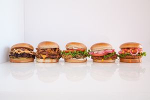 Variety of plant-based sandwiches and wraps at Earth Burger - Stone Ridge Market in San Antonio