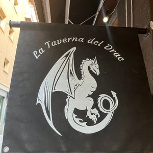 This Spanish restaurant has the coolest name and logo. at El Drac al Cau del Llop in Girona