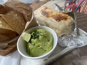 Vegan burrito (crispy) w. potatoes added, guac and chips  at Boca Grande in Columbia