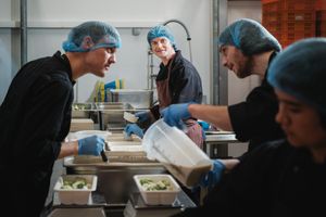 Busy in the kitchen cooking delicious Solid Stash meals at Solid Stash in Kortrijk