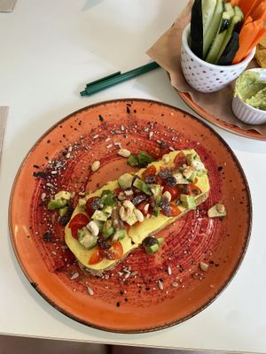 Vegan brunch - avo toast with cheese, hummus, Tomatos, nuts and raisins   at Coffee Break  in Salou