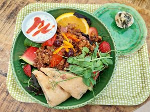 Salad with walnuts, sundried tomatoes, quinoa, watermelon, strawberries, tomato, foaccacia bread, etc. at Tant Grön in Vintrosa